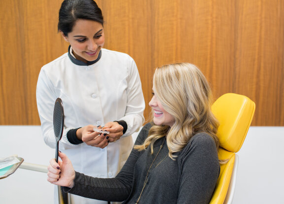 Doctor and Patient Looking Into Mirror